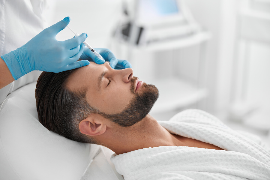 men undercoing aesthetic enhancement treatment